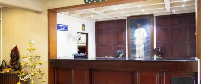 Hotel Thaai reception area interior opposite Coimbatore Railway Station showing front desk and traditional hospitality ambiance in Coimbatore