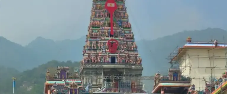 Front view of Marudhamalai Arulmigu Subramaniyaswami Temple gopuram in Coimbatore, dedicated to Lord Murugan, set against the Western Ghats
