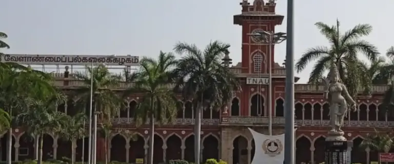 Tamil Nadu Agricultural University TNAU main building front view in Coimbatore with iconic red brick architecture and campus entrance
