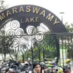 Kumaraswamy Lake Park main entrance arch with golden lettering and artistic tree metalwork, Thadagam Road, Coimbatore
