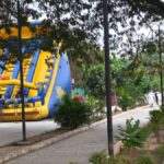Inflatable bounce slide and tree-lined walking path at Kumaraswamy Lake Park, R.S. Puram, Coimbatore