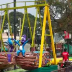 Kiddie boat swing amusement ride with cartoon characters at Kumaraswamy Lake Park, Coimbatore