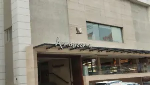 Annapoorna restaurant building exterior with its sign above the entrance and a bird logo on the facade